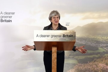 Theresa May defends green plan as critics say it is too slow and vague